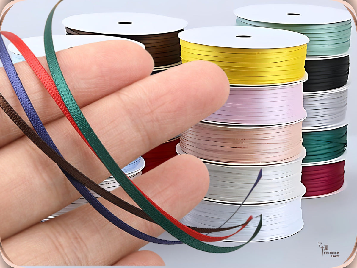 Thin double-sided satin ribbon spools in assorted colours
