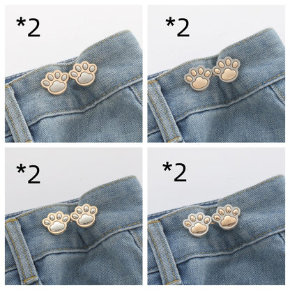 Eight sets of paw waist adjusters, two of each colour, shown on denim waistbands
