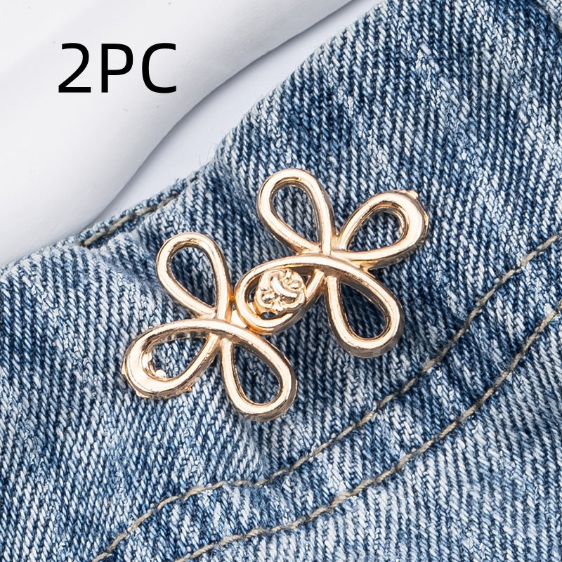 Golden clover flower waist adjuster, two sets, shown on a denim waistband