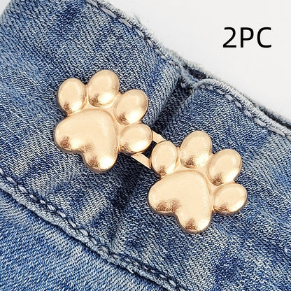 Two sets of golden dog paw waist tightener buttons, one pair shown on a denim waistband, labelled 2PC