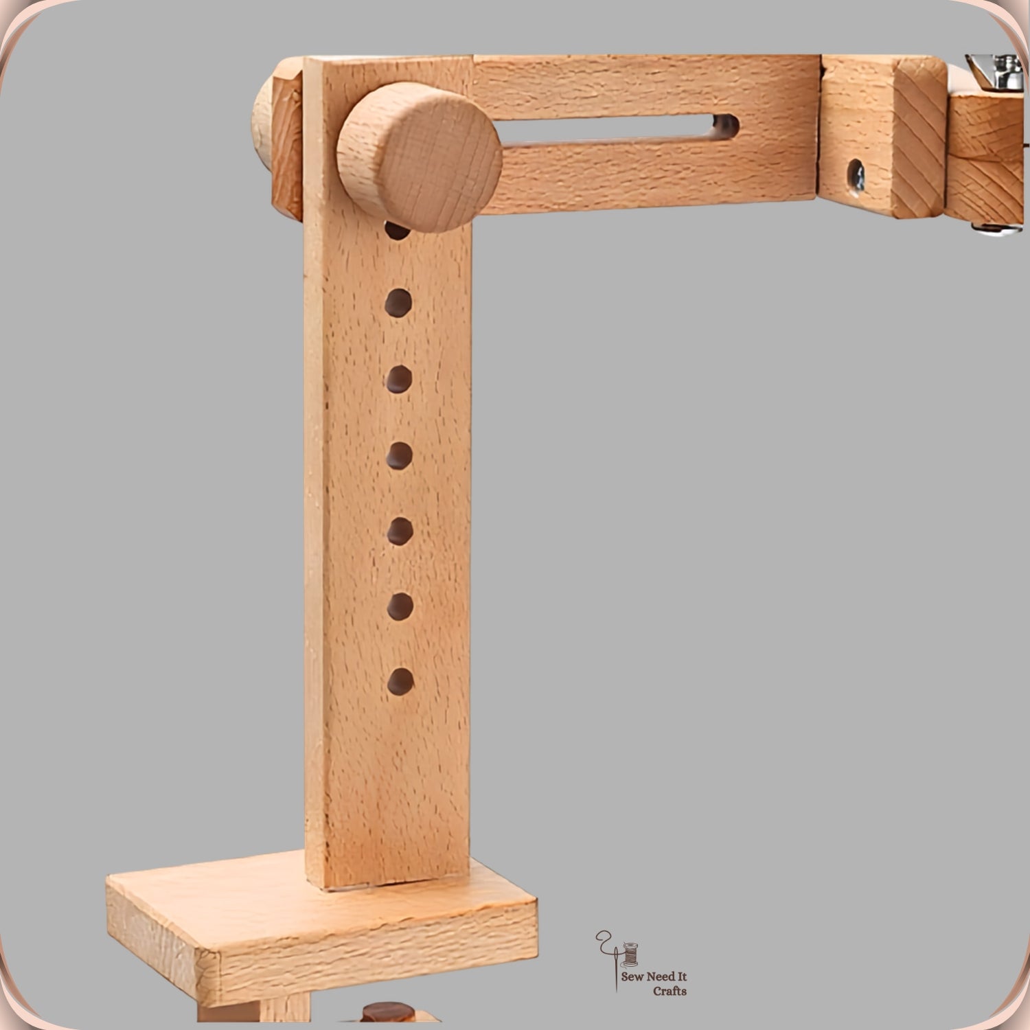 Side view of the assembled beechwood embroidery stand showing the drilled upright post and the table clamp beneath
