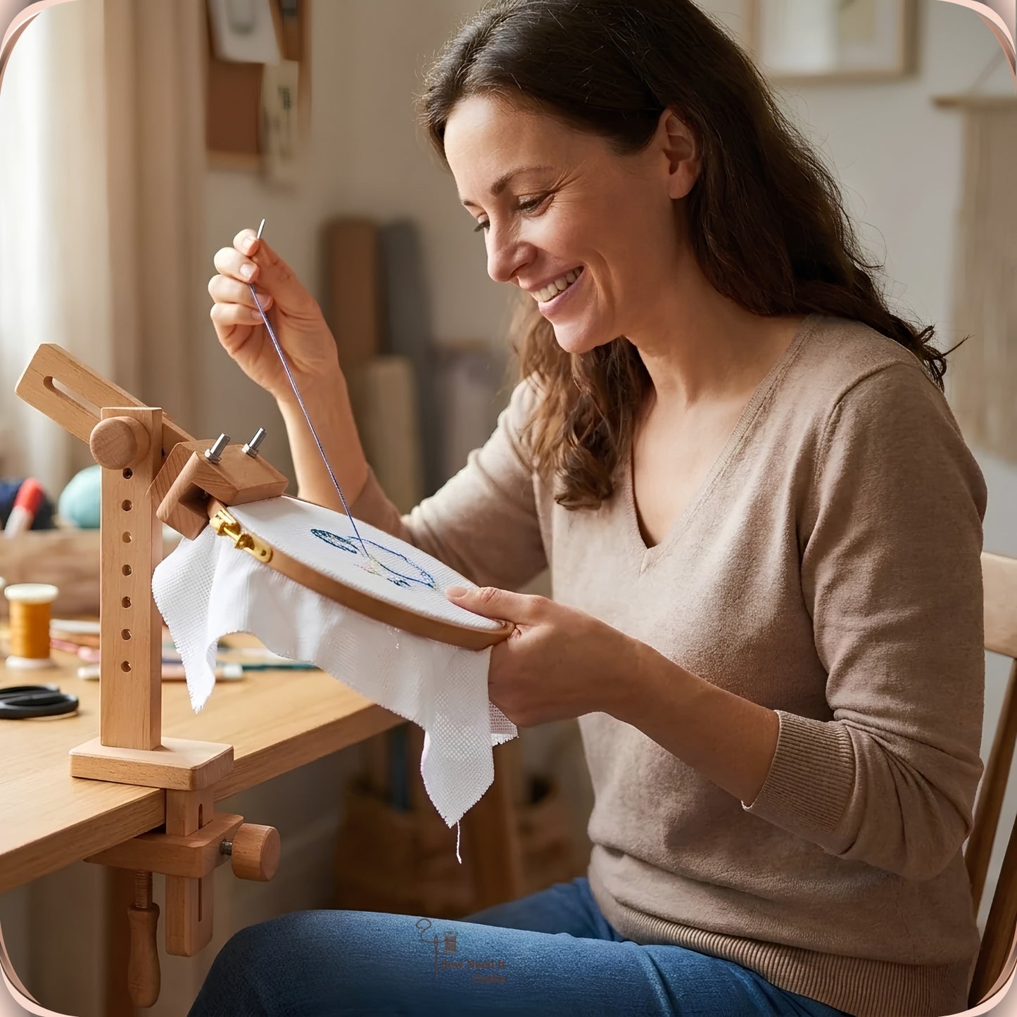 Woman stitching hands-free with both hands while the hoop is held by the beechwood clamp-on embroidery stand