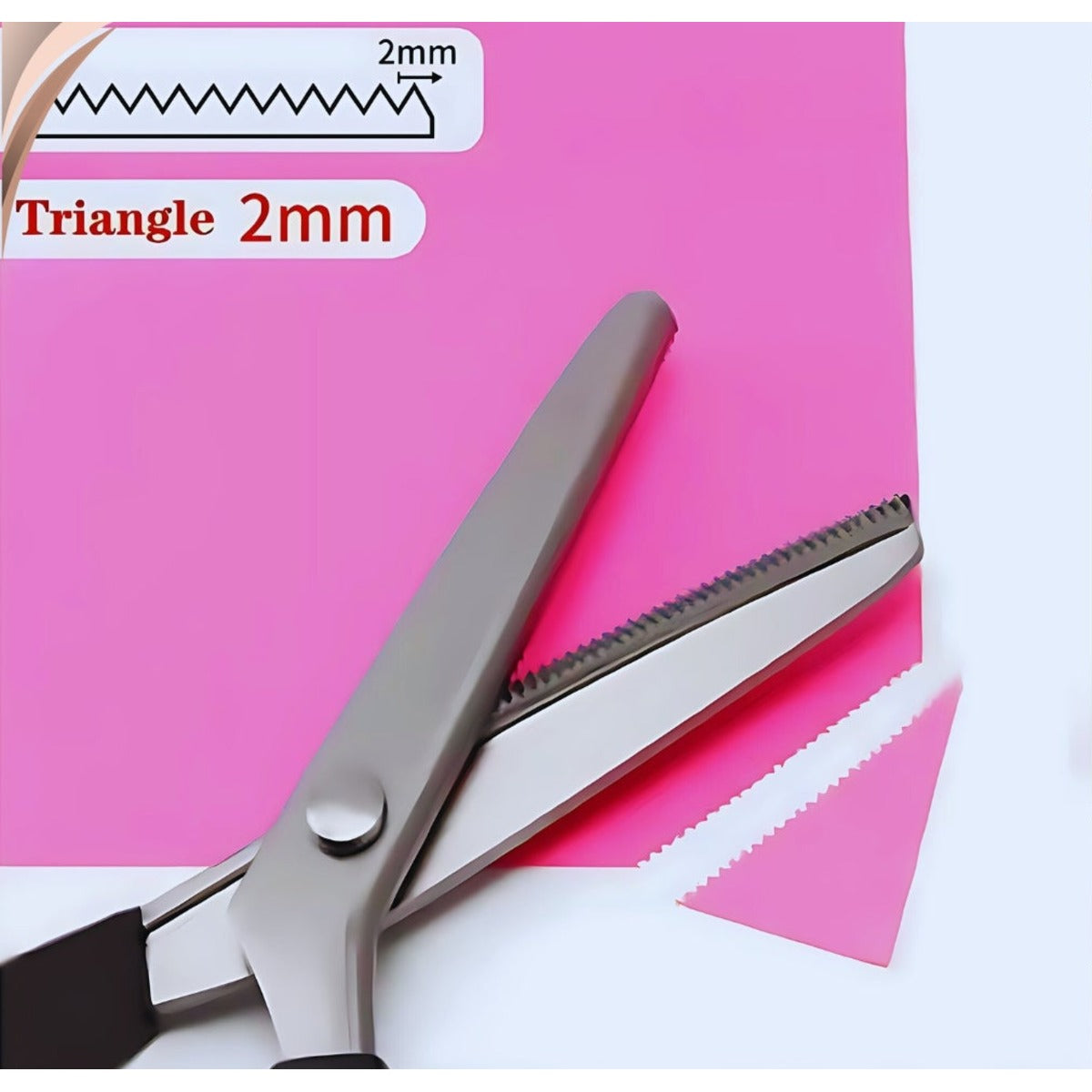 Triangular zigzag pinking shear with a 2 mm tooth pitch, shown with its blade profile diagram and the fine sawtooth edge it cuts in paper