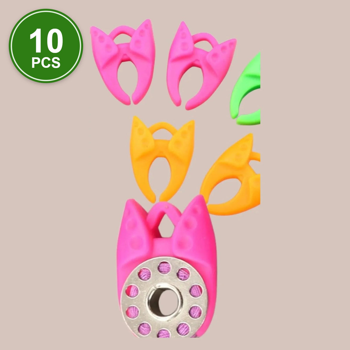 #2 Bobbin Clamps, 10 pcs: pink, orange and green silicone bobbin clamps, one holding a metal bobbin