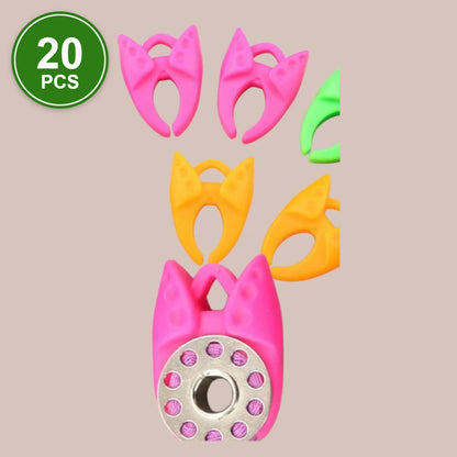 #2 Bobbin Clamps, 20 pcs: pink, orange and green silicone bobbin clamps, one holding a metal bobbin