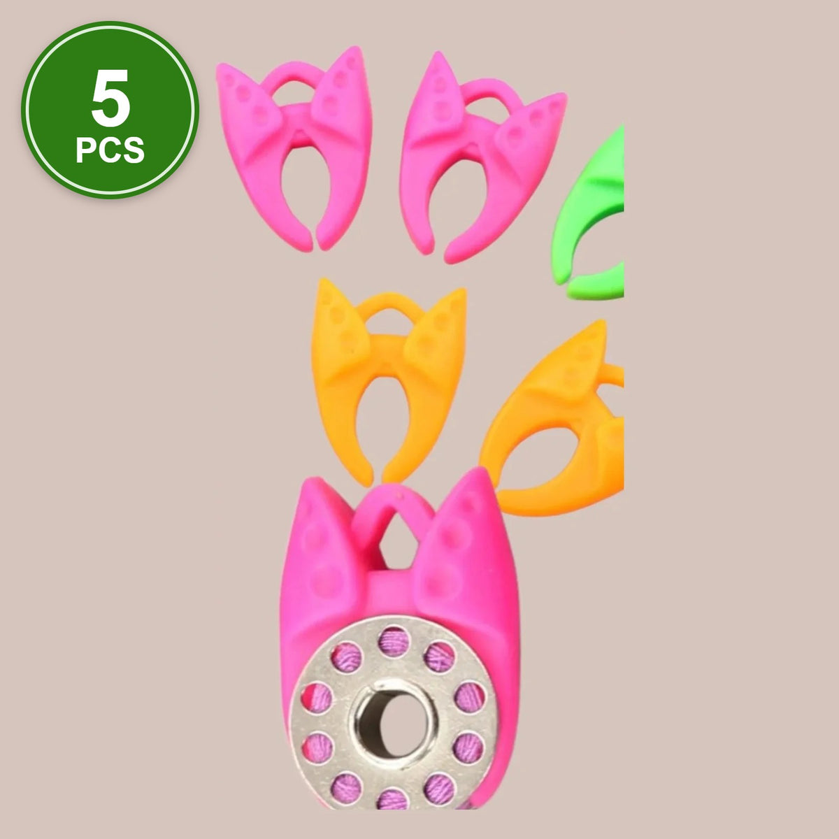 #2 Bobbin Clamps, 5 pcs: pink, orange and green silicone bobbin clamps, one holding a metal bobbin