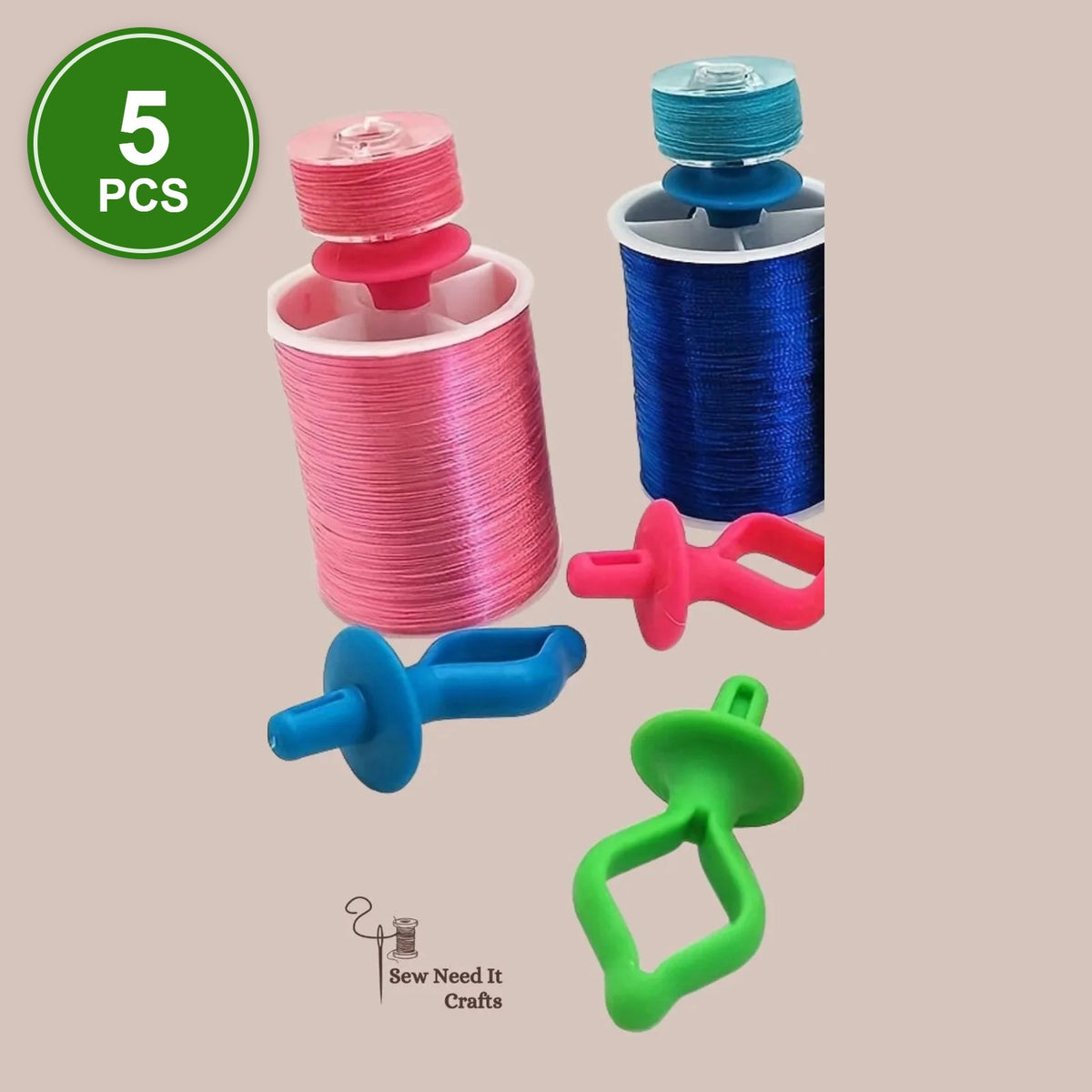 #1 Bobbin Holders, 5 pcs: silicone bobbin holders in pink, blue and green with bobbins on thread spools