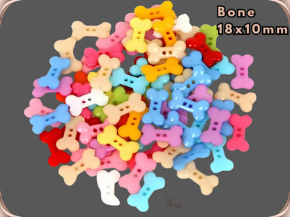 Bone shaped novelty sewing buttons, 18 x 10 mm, shown in assorted colours