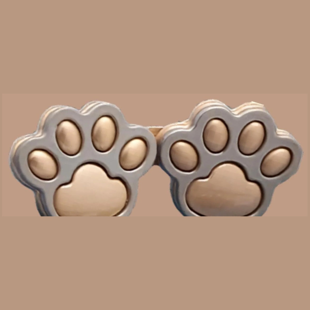 Matte gold paw print waist adjuster set, matte gold paw pads in a silver rim