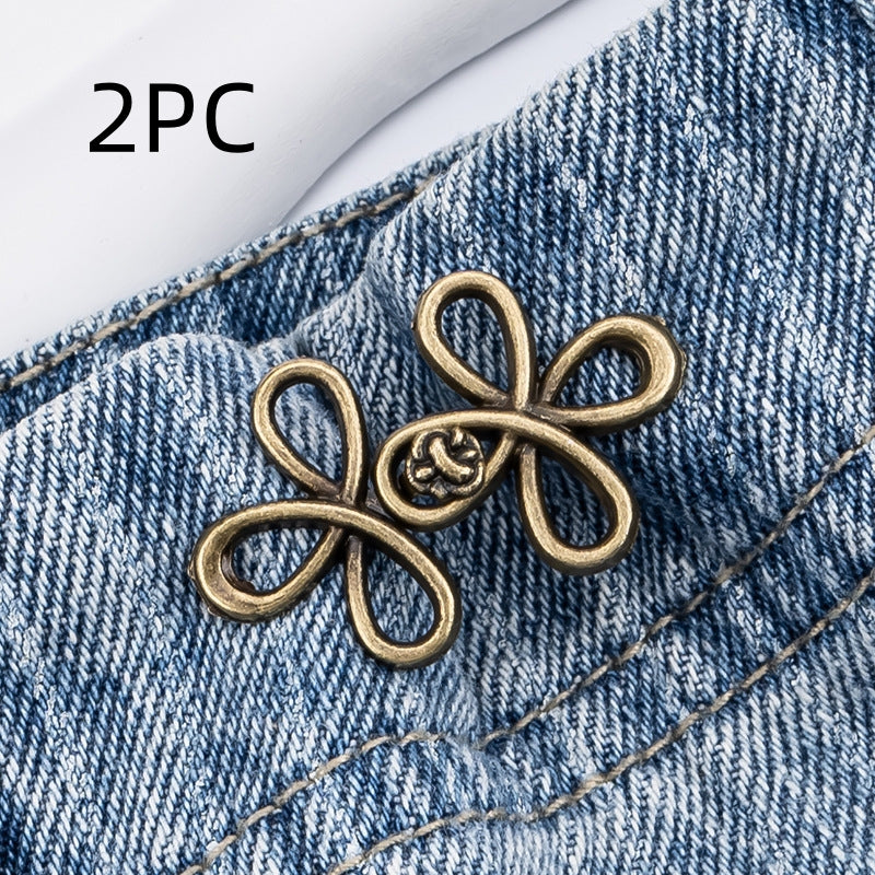 Bronze clover flower waist adjuster, two sets, shown on a denim waistband