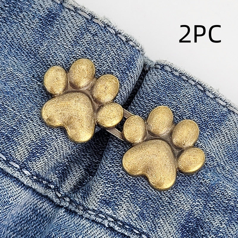 Two sets of bronze dog paw waist tightener buttons, one pair shown on a denim waistband, labelled 2PC