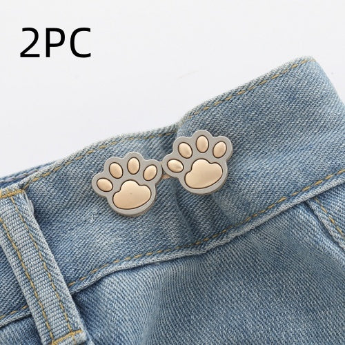 Two sets of matte gold paw waist adjusters on a denim waistband, labelled 2PC