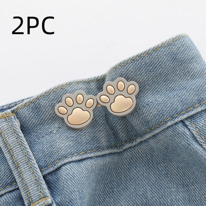 Two sets of matte gold paw waist adjusters on a denim waistband, labelled 2PC