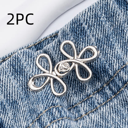 Silver clover flower waist adjuster, two sets, shown on a denim waistband