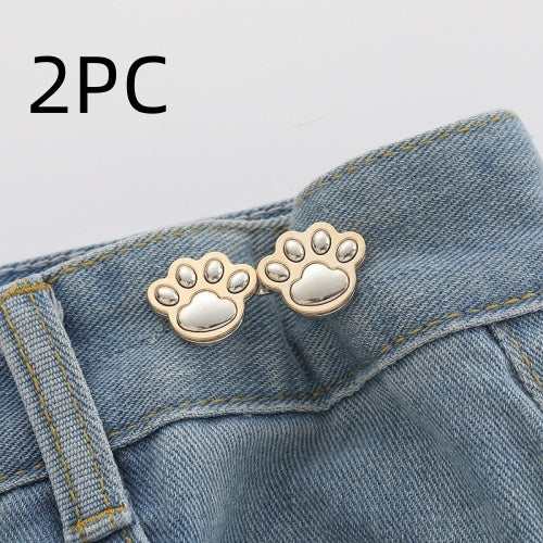 Two sets of bright silver paw waist adjusters on a denim waistband, labelled 2PC