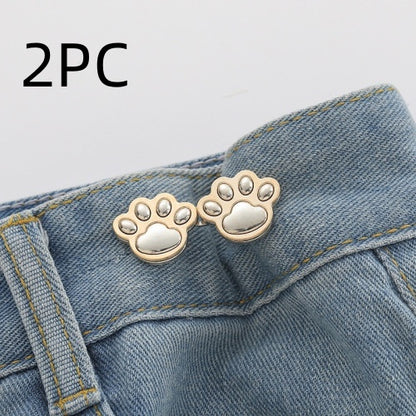 Two sets of bright silver paw waist adjusters on a denim waistband, labelled 2PC