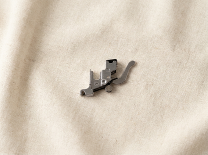 Flat lay of Husqvarna Viking snap-on adapter with accessories
