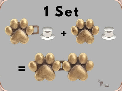 What one set contains: two bronze paw buttons and two silver locking pin backs, joining into one connected pair