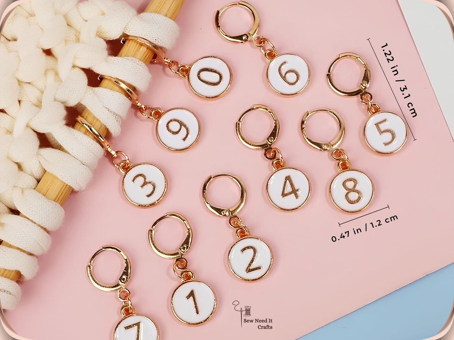 White enamel numbered stitch markers with measurement labels showing 1.22 in / 3.1 cm overall length and 0.47 in / 1.2 cm charm diameter