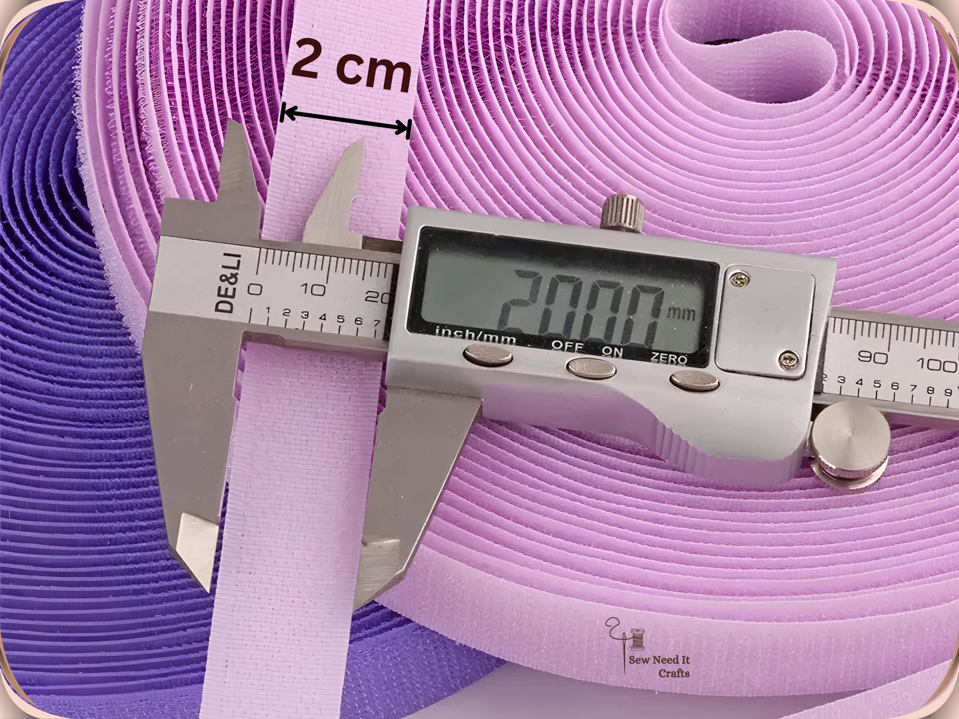 Digital caliper measuring the width of light purple hook and loop tape at 20.00 mm, labelled 2 cm
