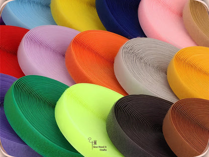 Close-up of coiled 20 mm sew-on hook and loop tape in many colors including red, orange, green, grey, pink and brown