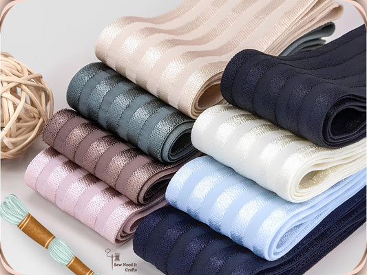 2 inch satin stripe elastic band for sewing folded in eight colors including beige, teal, mauve, pink, navy, ivory and light blue