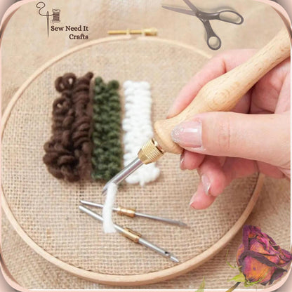 Wooden punch needle making brown, green and white yarn loops on fabric in a round wooden hoop