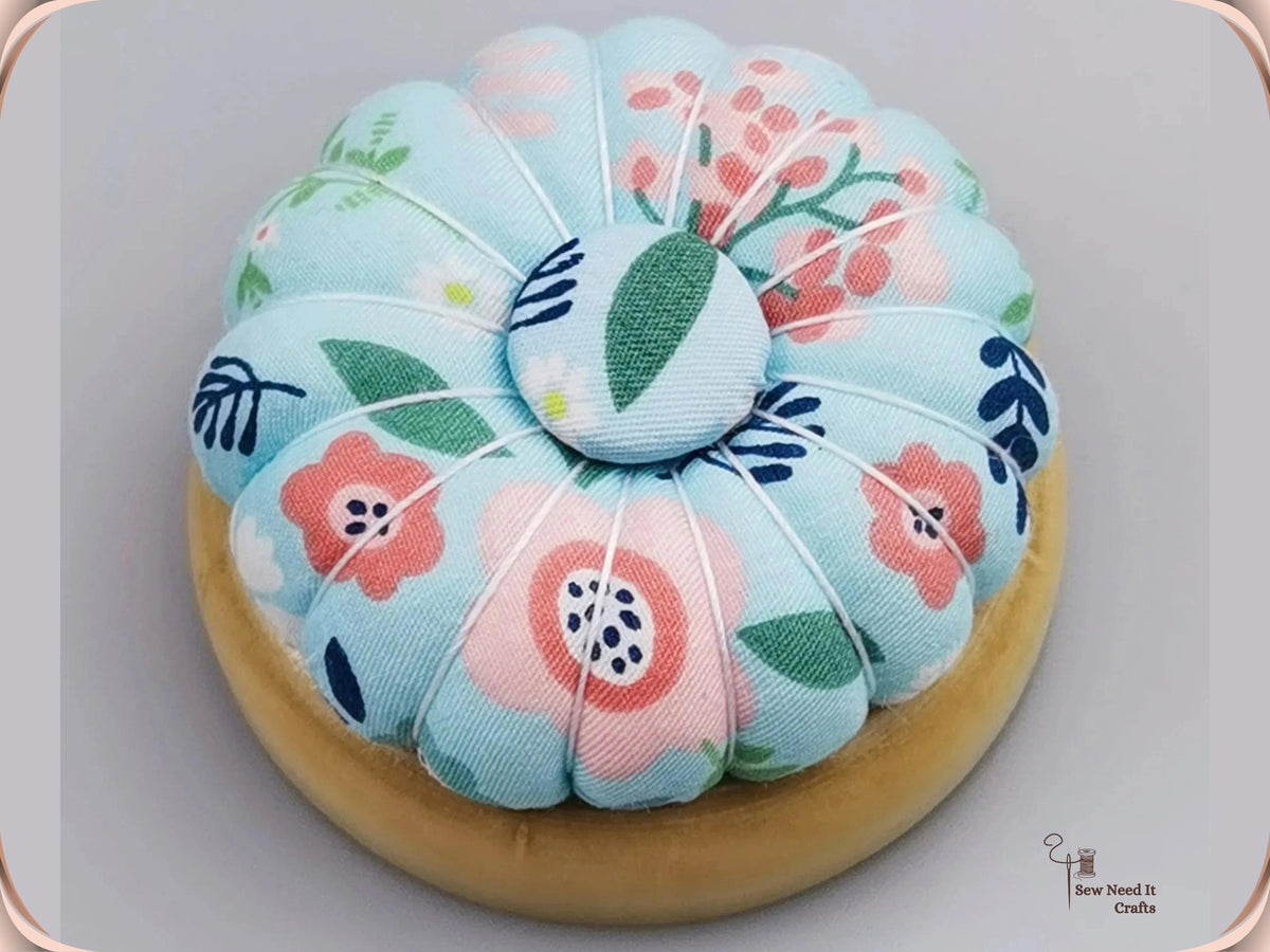 Sky Blue Floral pumpkin pin cushion on a natural wooden base