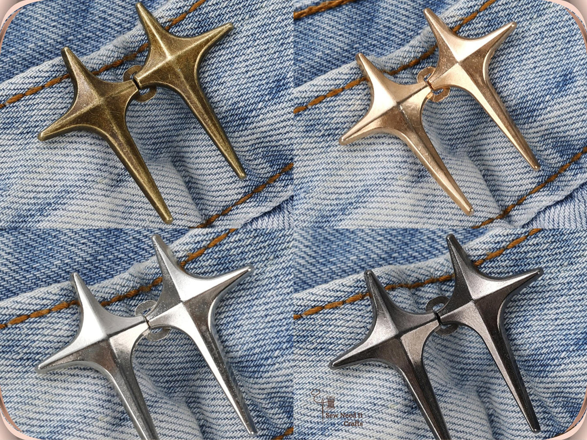 Bronze, golden, silver and gunmetal sparkle star jean pins, each pair hooked together on light denim