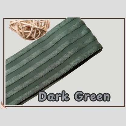 Dark green 2 inch satin stripe elastic band for sewing, folded flat and labelled Dark Green