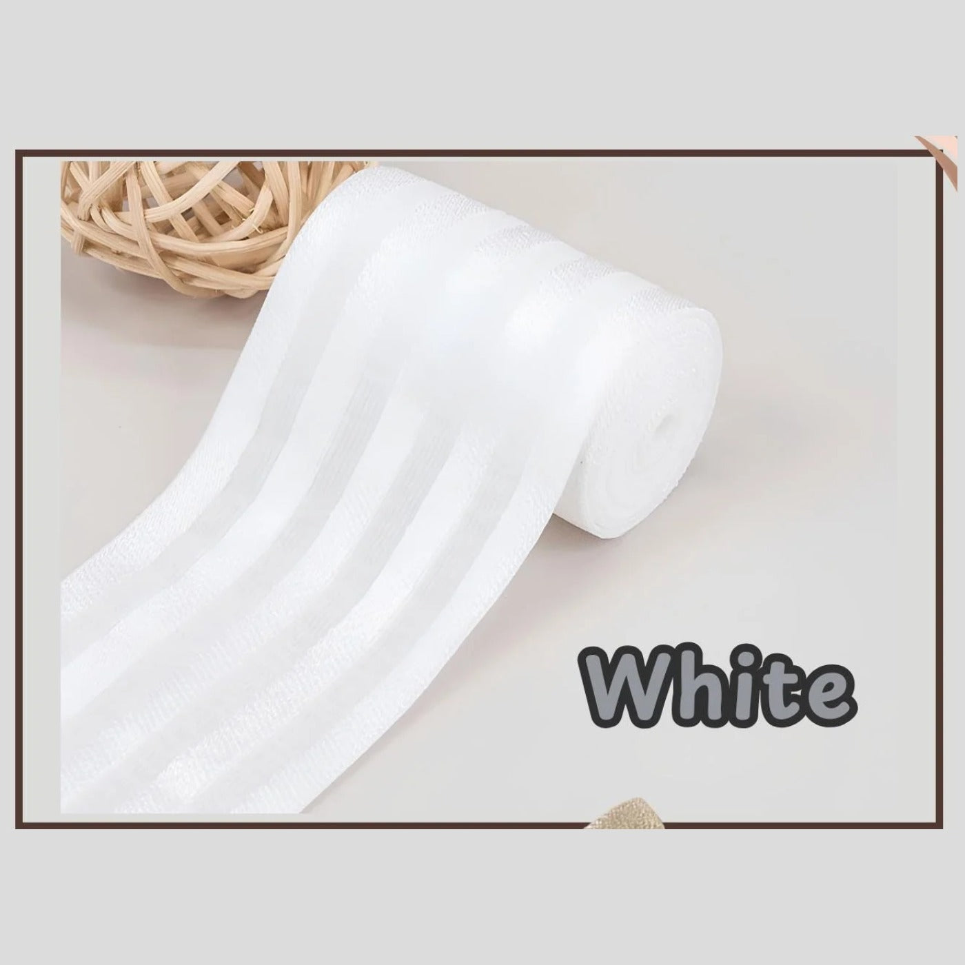 White 2 inch satin stripe elastic band for sewing, partly rolled and labelled White