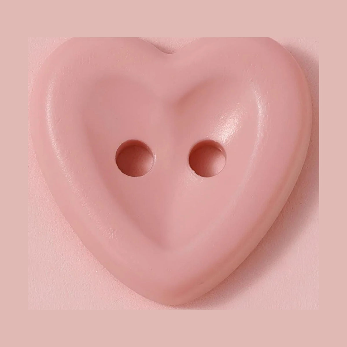 Pink heart shaped macaron button for sewing