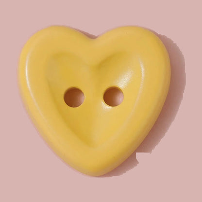 Yellow heart shaped macaron button for sewing