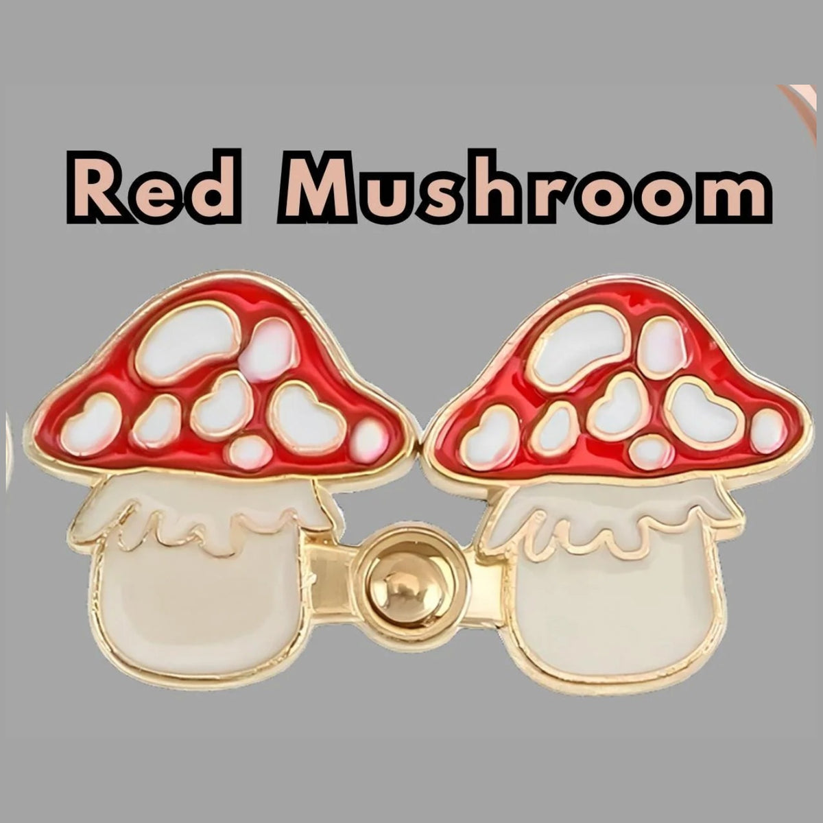Red mushroom enamel no-sew waist tightener pins, one set: two red and white spotted mushroom pins joined by a gold peg-and-ring snap