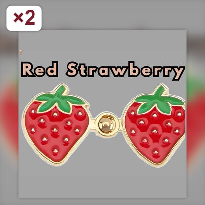 Two sets of red strawberry enamel no-sew waist tightener pins with gold peg-and-ring snaps