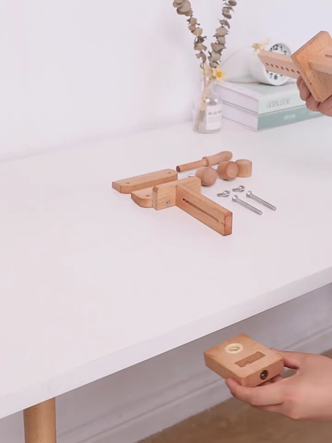 Assembly video showing the beechwood embroidery stand being clamped to a table edge, the upright and jointed arm fitted, and an embroidery hoop clamped into the wooden splint
