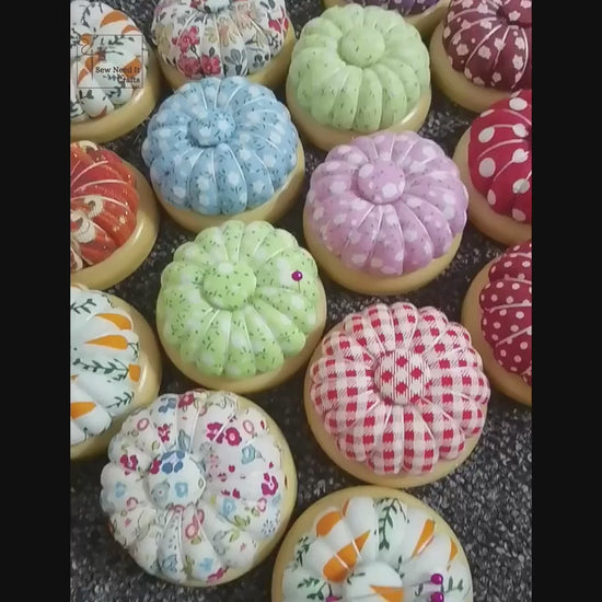 Video: needles laid on the magnetic center of wooden-base pumpkin pin cushions, and the flat wooden base underneath