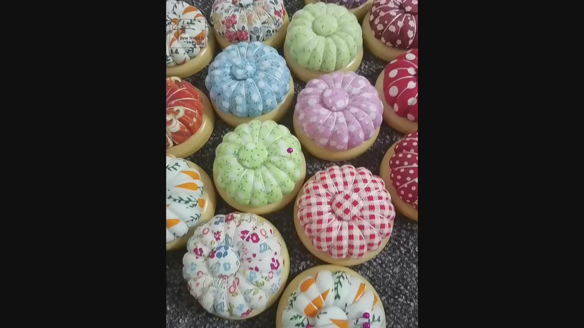 Video: needles laid on the magnetic center of wooden-base pumpkin pin cushions, and the flat wooden base underneath