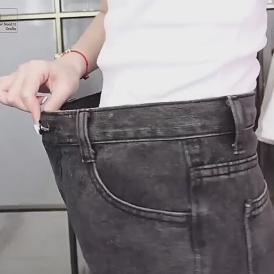 Video: strawberry, frog and mushroom waist tightener pins shown in hand, then a strawberry pair being pinned, capped and snapped together on a jeans waistband