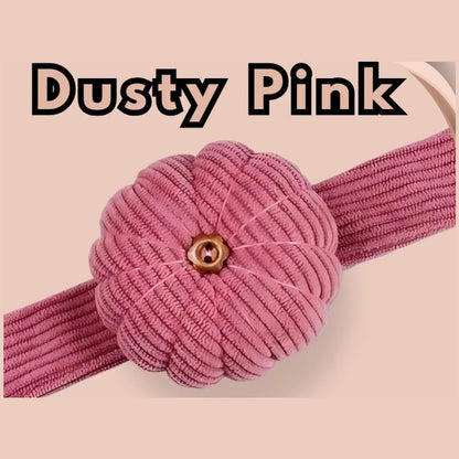 Dusty pink corduroy pumpkin pin cushion on its matching dusty pink wrist band