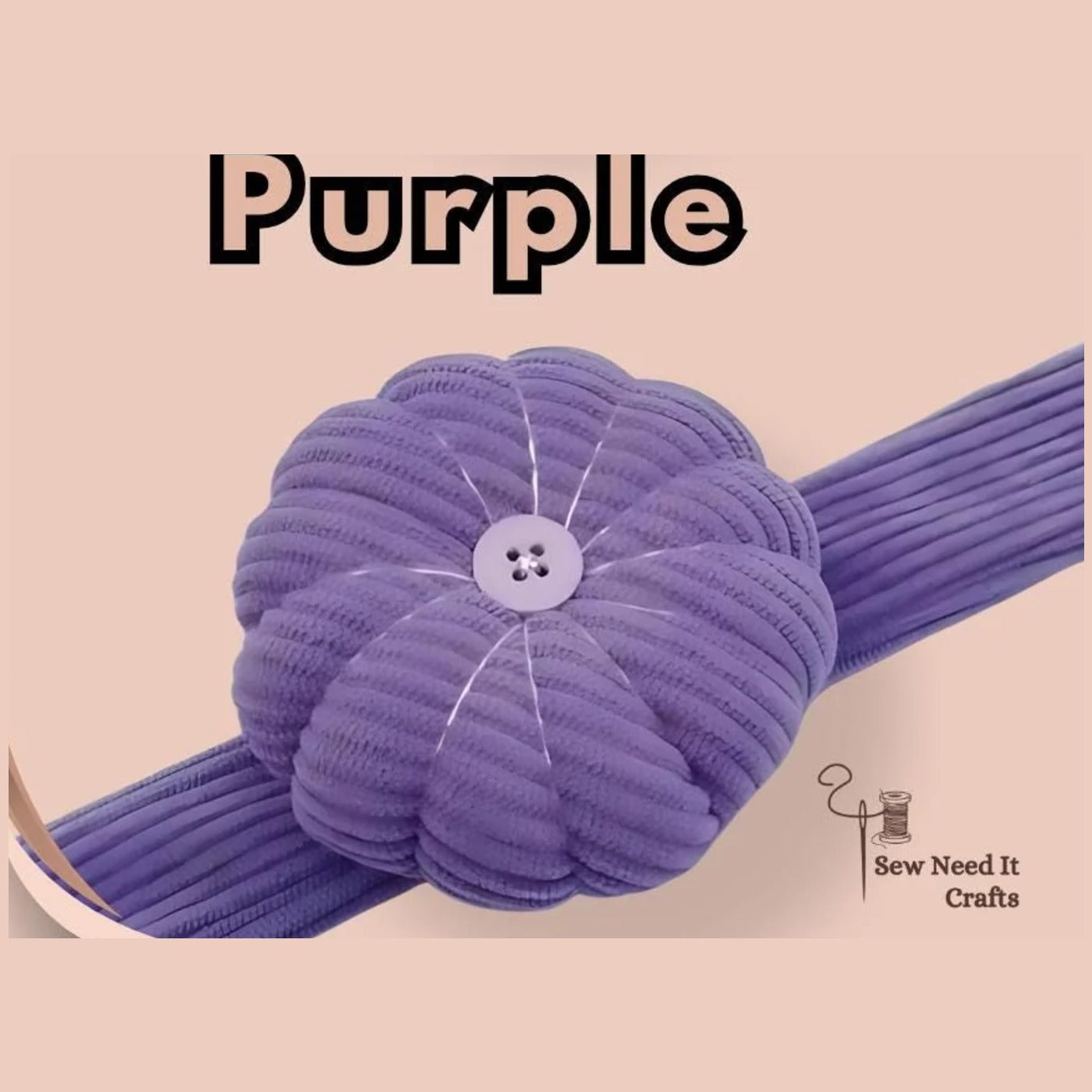 Purple corduroy pumpkin pin cushion with a white button, on its matching band