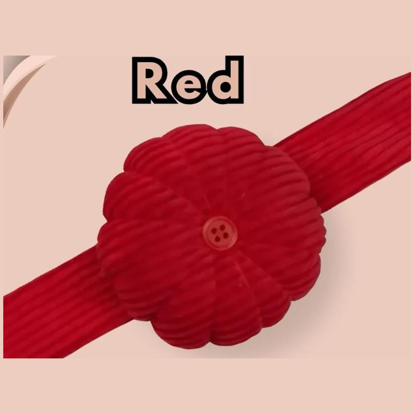 Red corduroy pumpkin pin cushion on its matching red snap-on wrist band